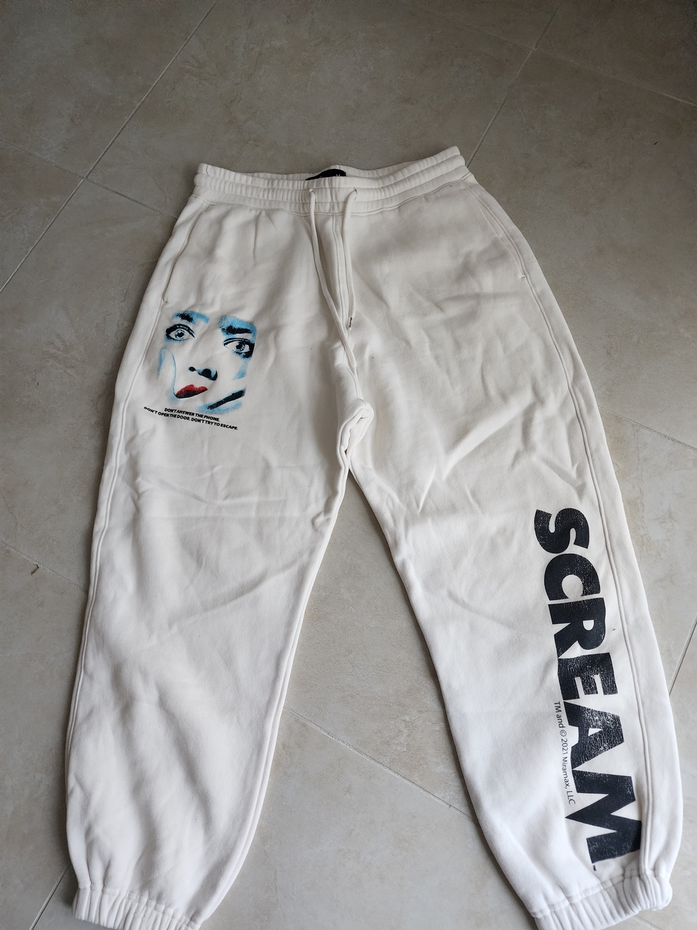 Hollister White Joggers with 'Scream' Side Print and Face Graphic